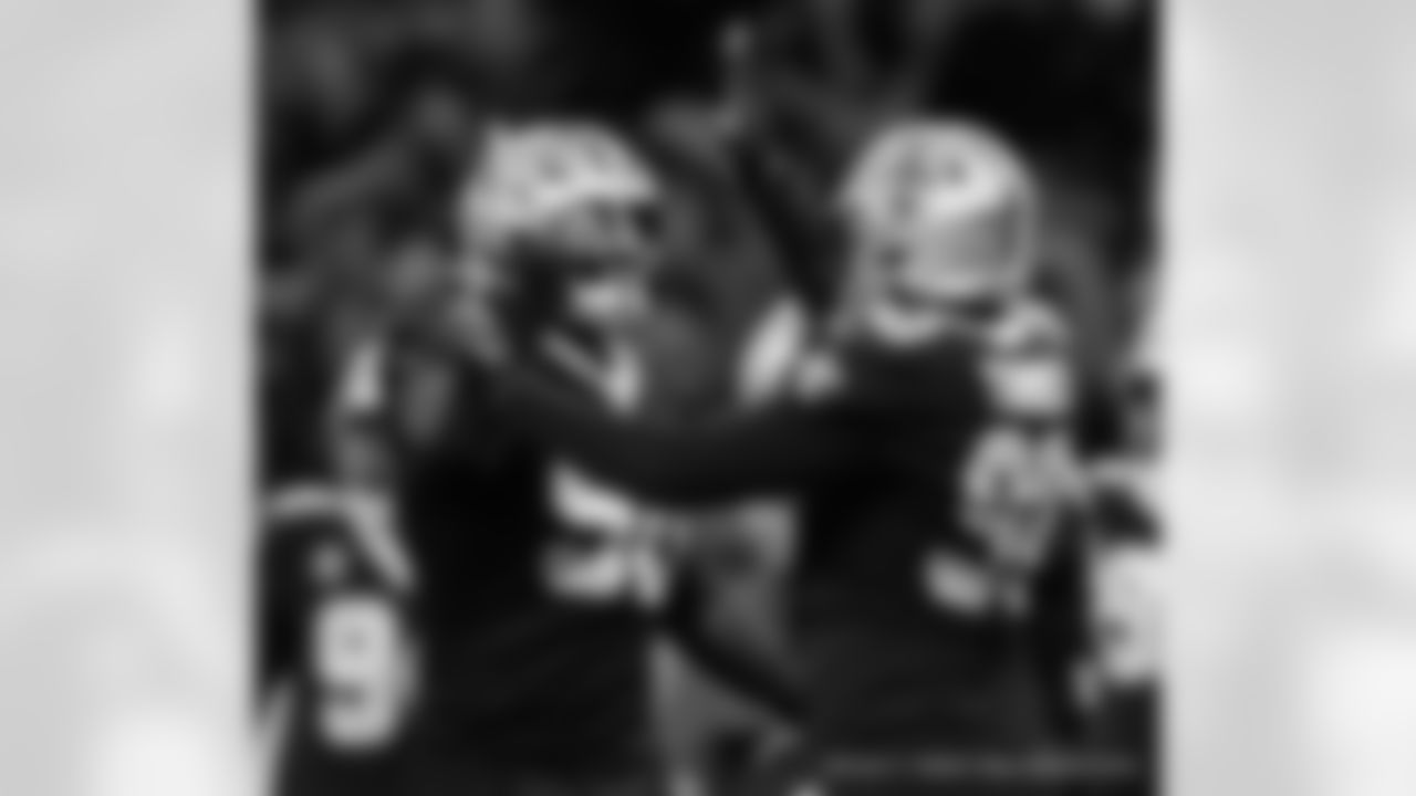 New Orleans Saints defensive linemen Tanoh Kpassagnon and Payton Turner in action during their 2022 Week 8 game against the Las Vegas Raiders.