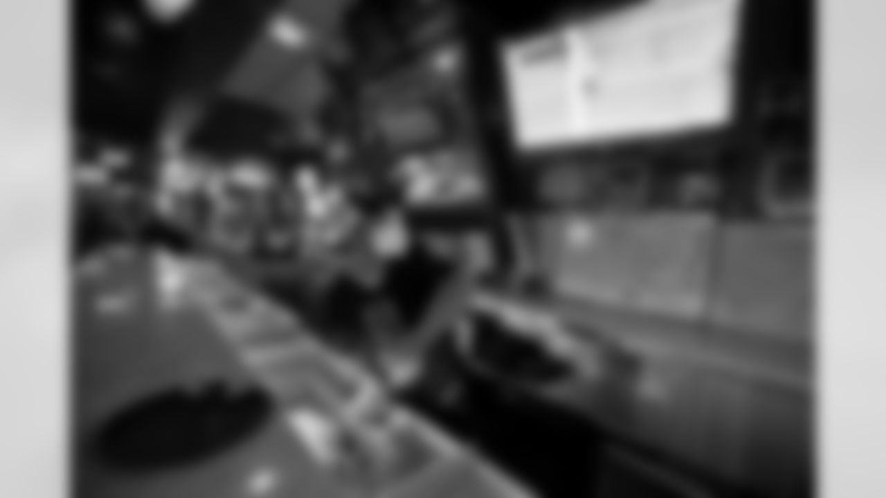 Oyster shucker Steven Leblanc glances at the game while working at Acme Oyster House in the French Quarter as the New Orleans Saints open their season against the Tampa Bay Buccaneers on Sunday, September 13, 2020. (Photo by Michael DeMocker, NFL LCC)