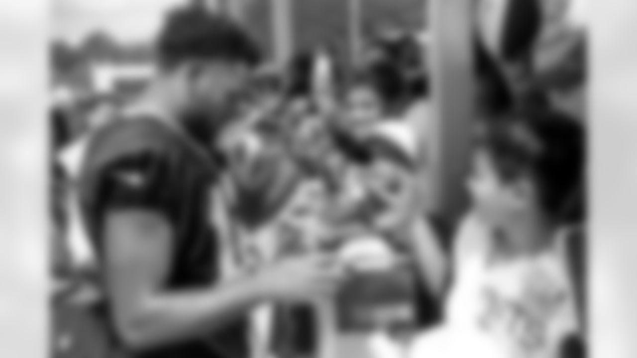 New Orleans Saints wide receiver Chris Olave greets fans at the first open practice of the year at 2022 Saints Training Camp presented by Rouses Markets on Saturday, July 30 at the Ochsner Sports Performance Center.