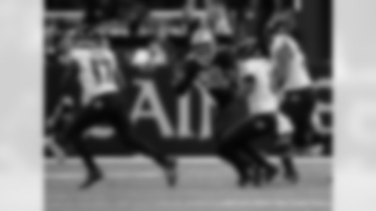 New Orleans Saints players in action during their 2022 Week 9 game against the Baltimore Ravens.