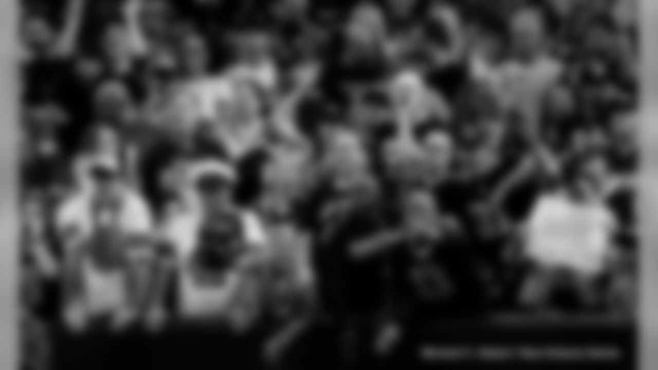 New Orleans Saints fans cheer on the team against the San Francisco 49ers at the Mercedes-Benz Superdome.