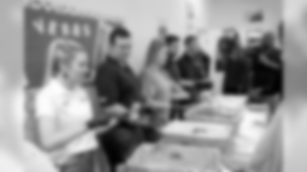 New Orleans Saints defensive end Cameron Jordan visits with students enjoying a Thanksgiving dinner courtesy of the Dudley DuBosier law firm at the Youth Empowerment Project adult education center on Tuesday, November 19, 2019.