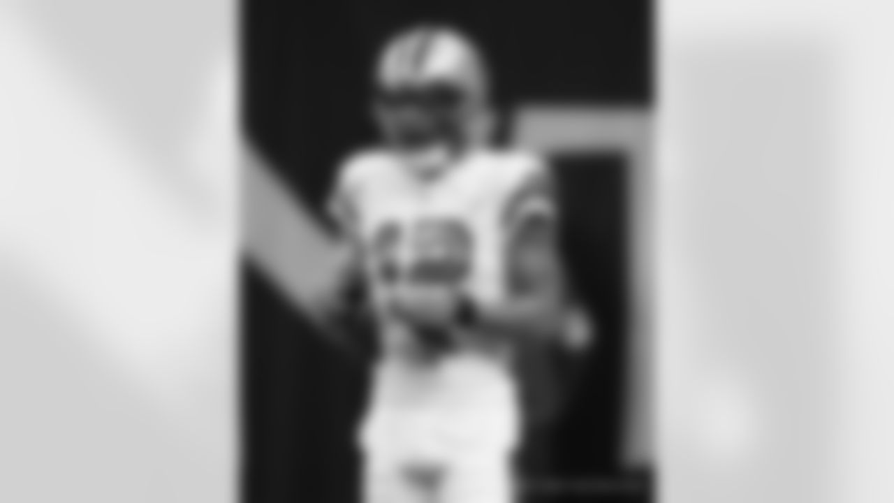New Orleans Saints players and coaches prepare to take on the Tampa Bay Buccaneers in Week 8 of the 2021 NFL season.
