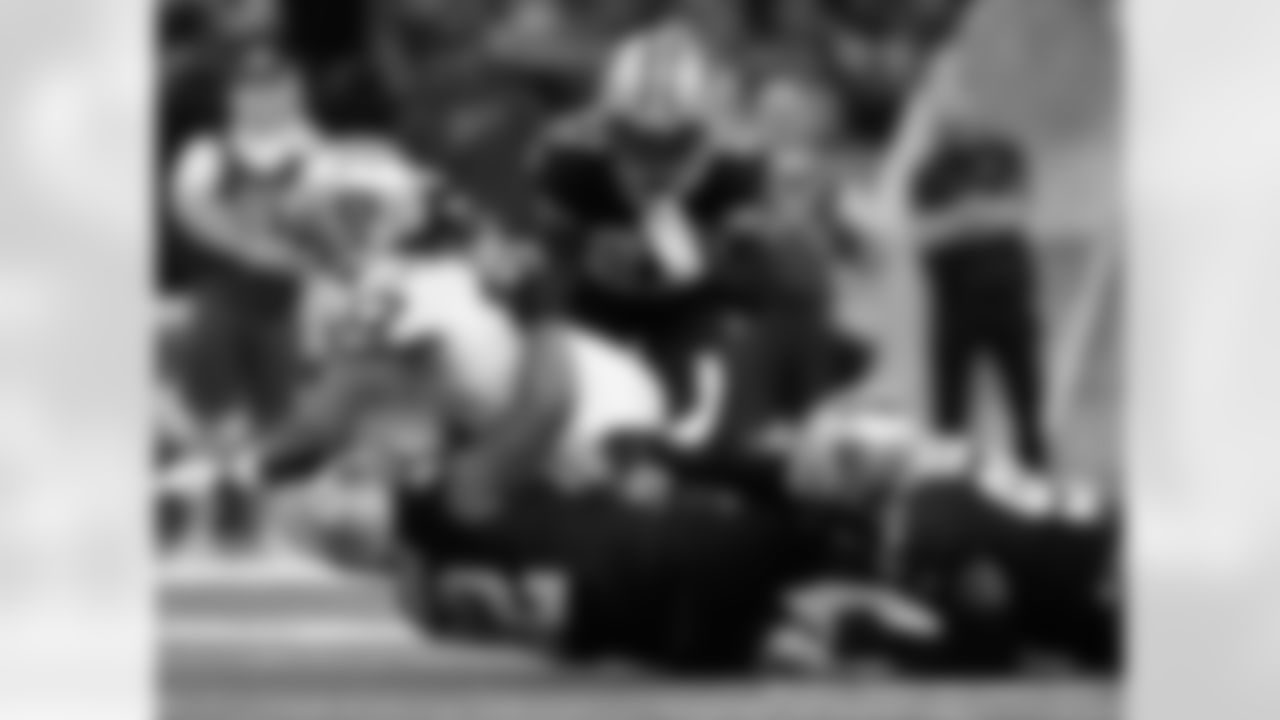 New Orleans Saints defensive linemen Marcus Davenport and Malcolm Roach and cornerback Alontae Taylor in action during their 2022 Week 8 game against the Las Vegas Raiders.