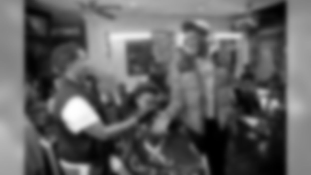 New Orleans Saints wide receiver Michael Thomas provided fresh holiday hair cuts and prize packs to local youth at the Executive Suite Barber Lounge on December 24, 2019.
