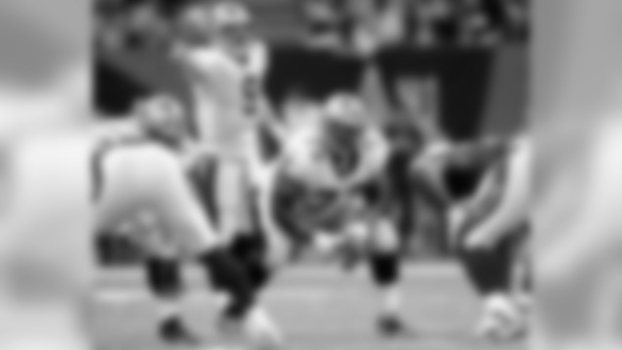 RG Jahri Evans listens to Drew Brees' commands.