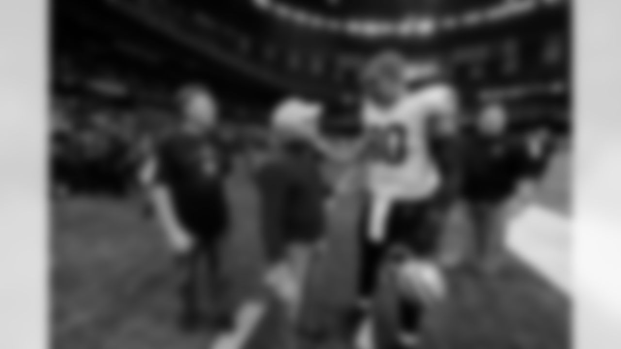 A frequent guest at Training Camp and home games, the New Orleans Saints remember music legend and fan Jimmy Buffett who passed away at the age of 76 on September 1, 2023 photographed here alongside tight end Jimmy Graham (80).