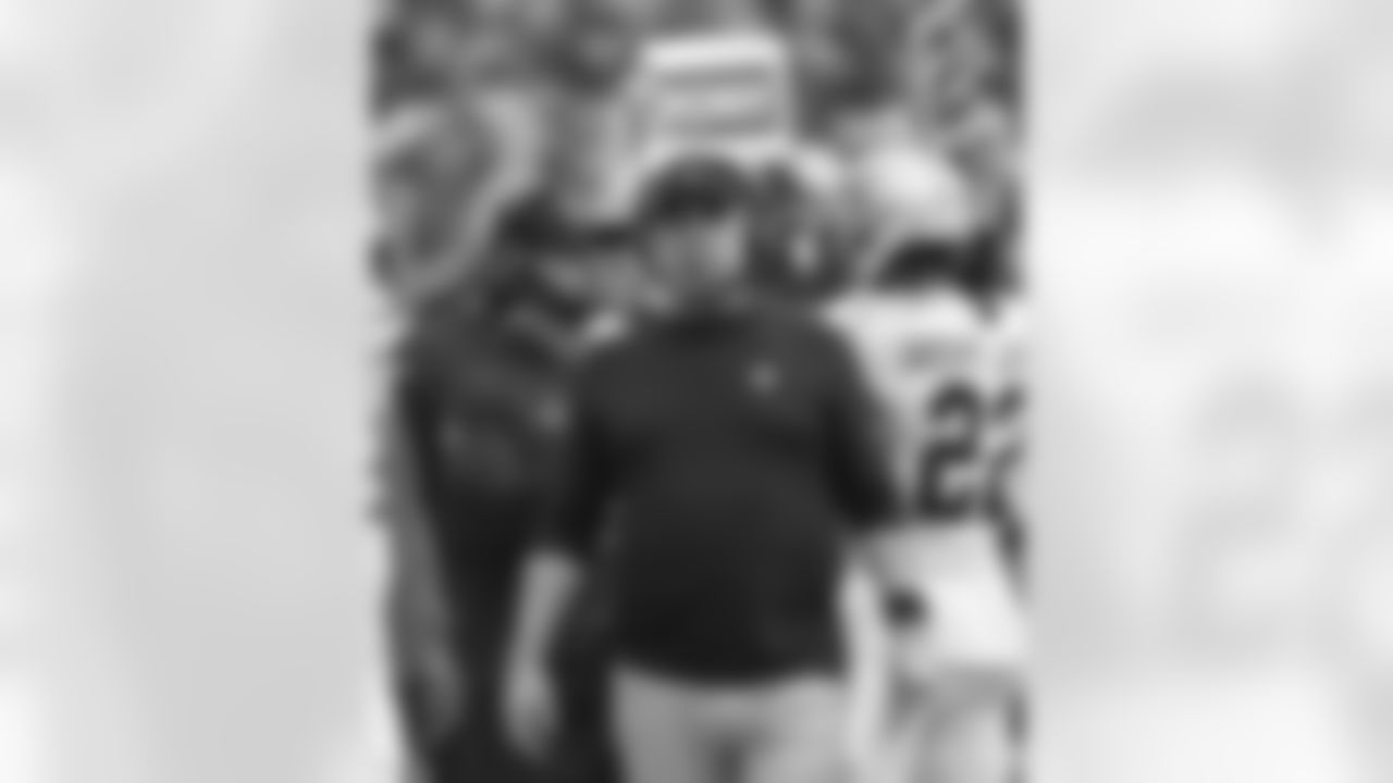 Coaches and staff of the New Orleans Saints take in Week 5 from the sidelines against the Washington Football Team on October 10, 2021.