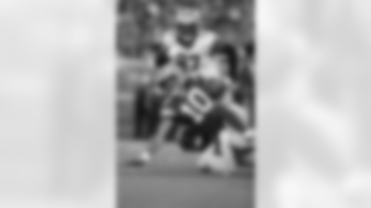 New Orleans Saints players in action during their 2022 Preseason Week 2 game against the Green Bay Packers.