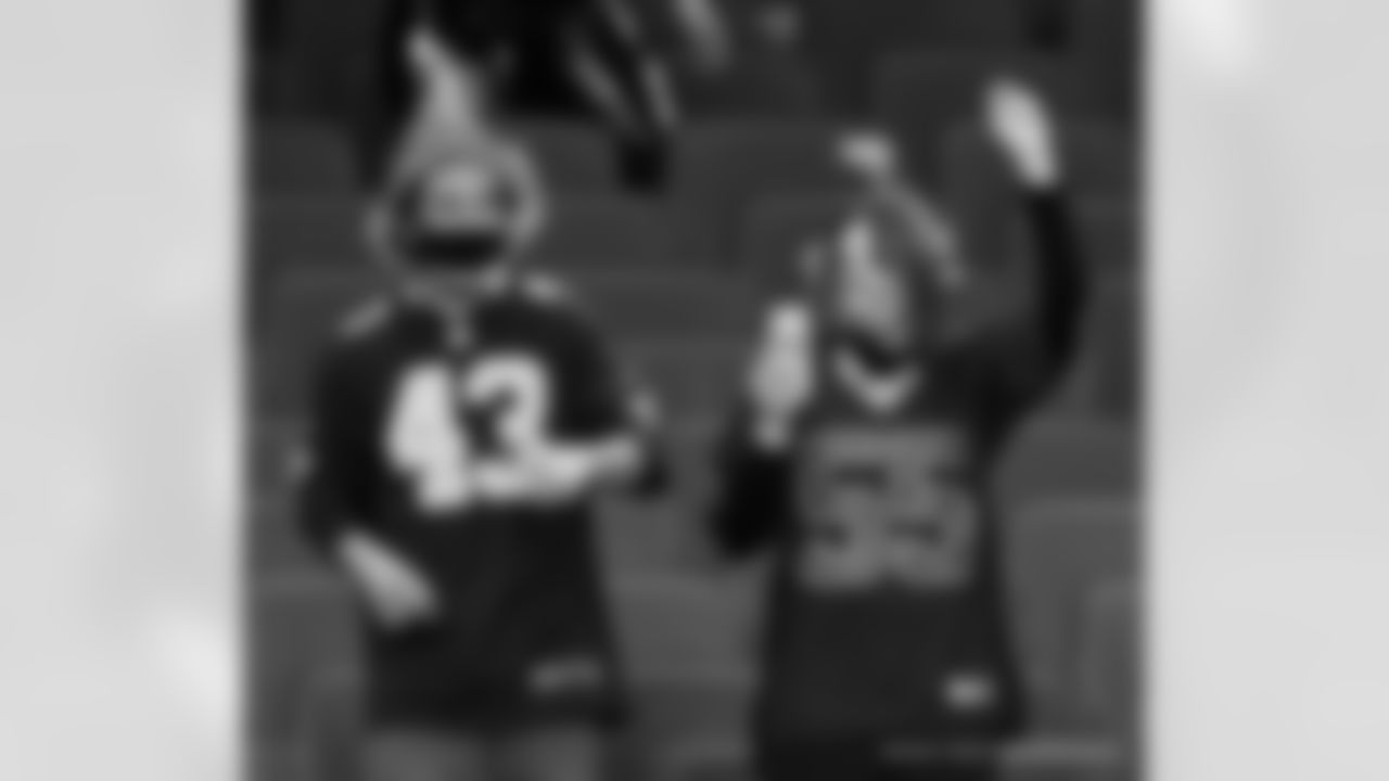 New Orleans Saints fans cheer on the team from inside the Mercedes-Benz Superdome against the Minnesota Vikings on Christmas Day in Week 16 of the 2020 NFL season.