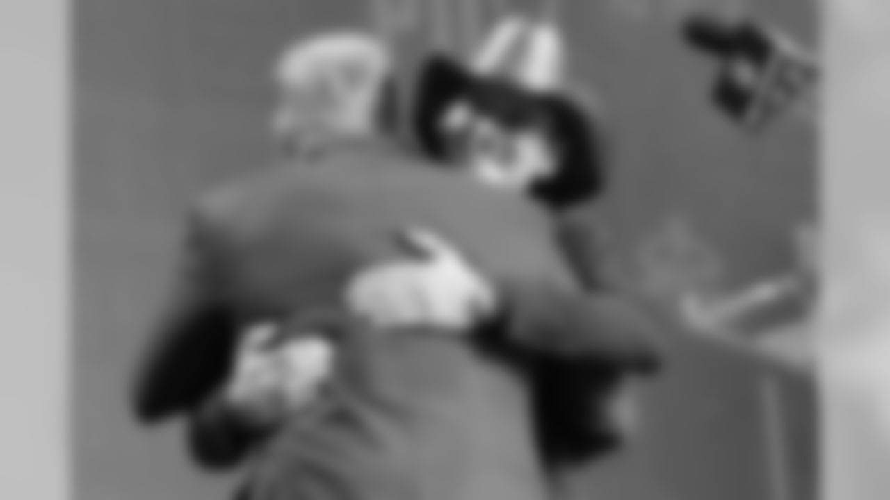 Country music star Tim McGraw hugs NFL Commissioner Roger Goodell ahead of the second round of the NFL football draft, Friday, April 26, 2019, in Nashville, Tenn. (AP Photo/Mark Humphrey)
