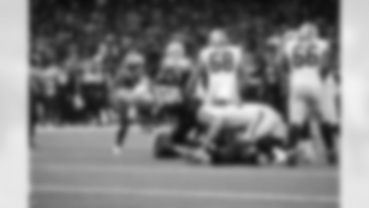Check out photos of New Orleans Saints defensive end Marcus Davenport in action throughout the 2022 season.