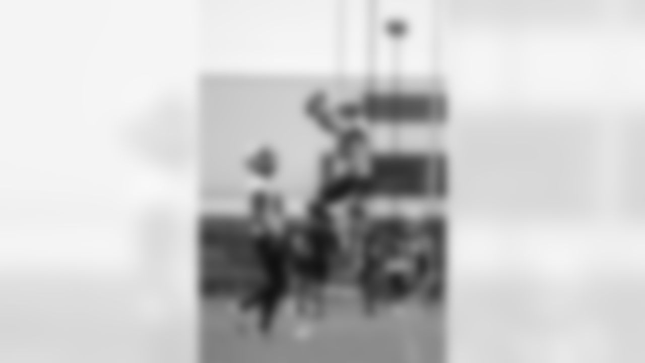 New Orleans Saints wide receiver Chris Olave leaps for a ball at the team's 2022 OTA practices on June 9, 2022 at the Ochsner Sports Performance Center.