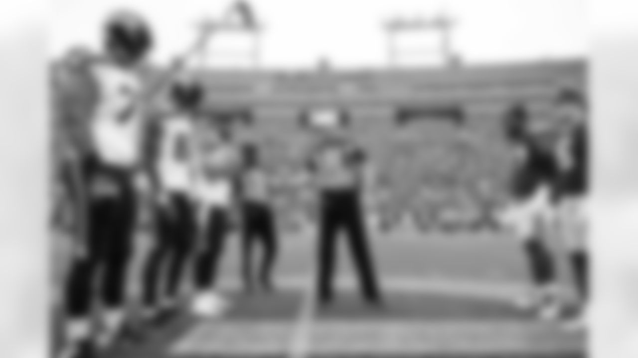 Head referee Craig Wrolstad adminsters the pregame coin toss before the game. Seahawks captains for the game were Nick Bellore, John Hall and Stone Forsythe.