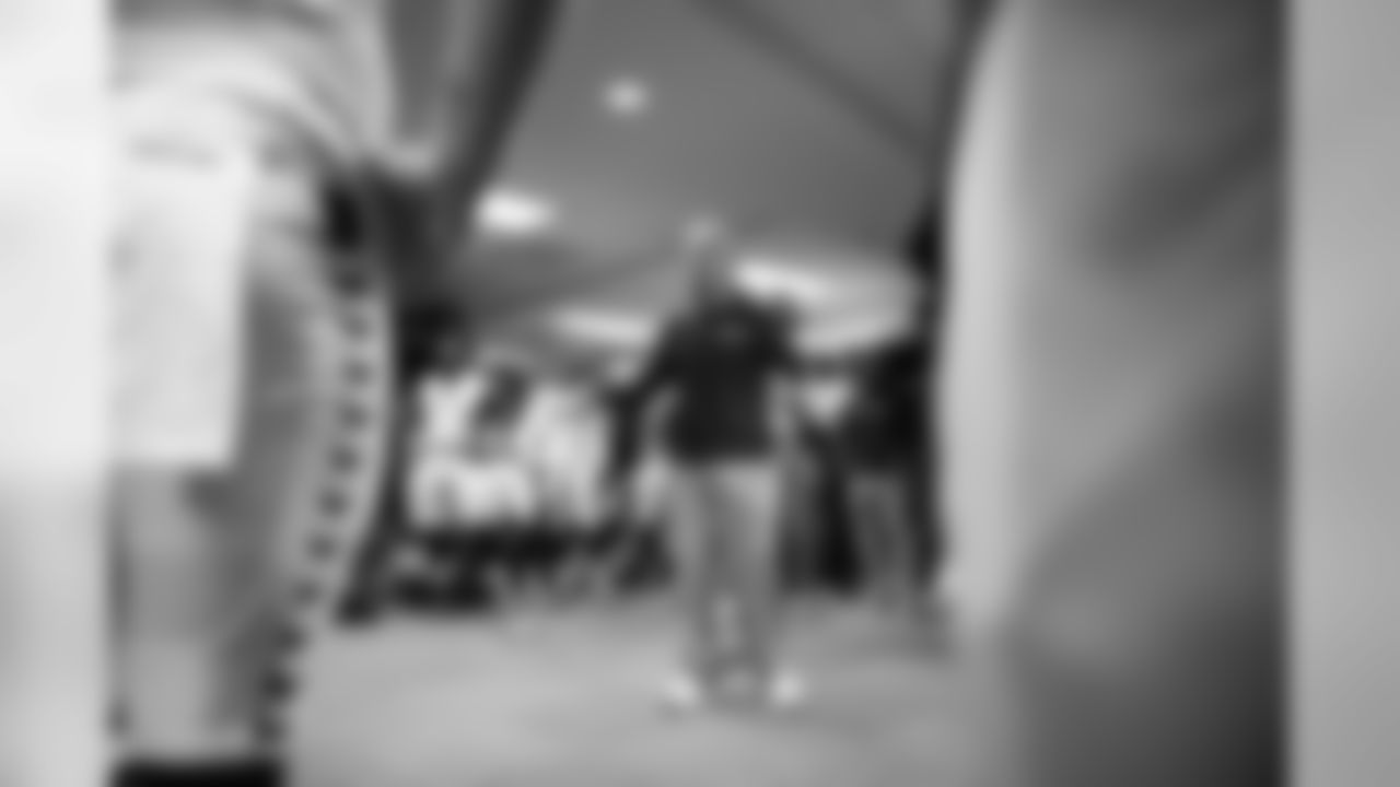 In the locker room, head coach Pete Carroll talked to his players after the game.