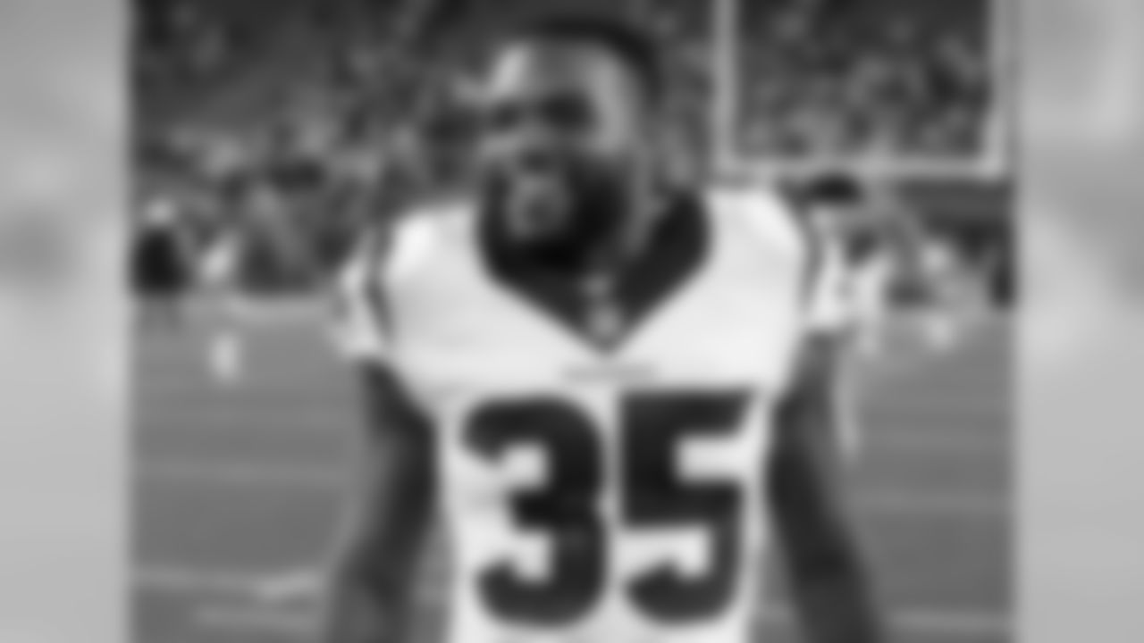 Houston Texans defensive back Eddie Pleasant (35) has a hearty laugh after the 2015 week 10 regular season NFL football game against the Cincinnati Bengals on Monday, Nov. 16, 2015 in Cincinnati. The Texans won the game 10-6. (Paul Spinelli via AP)