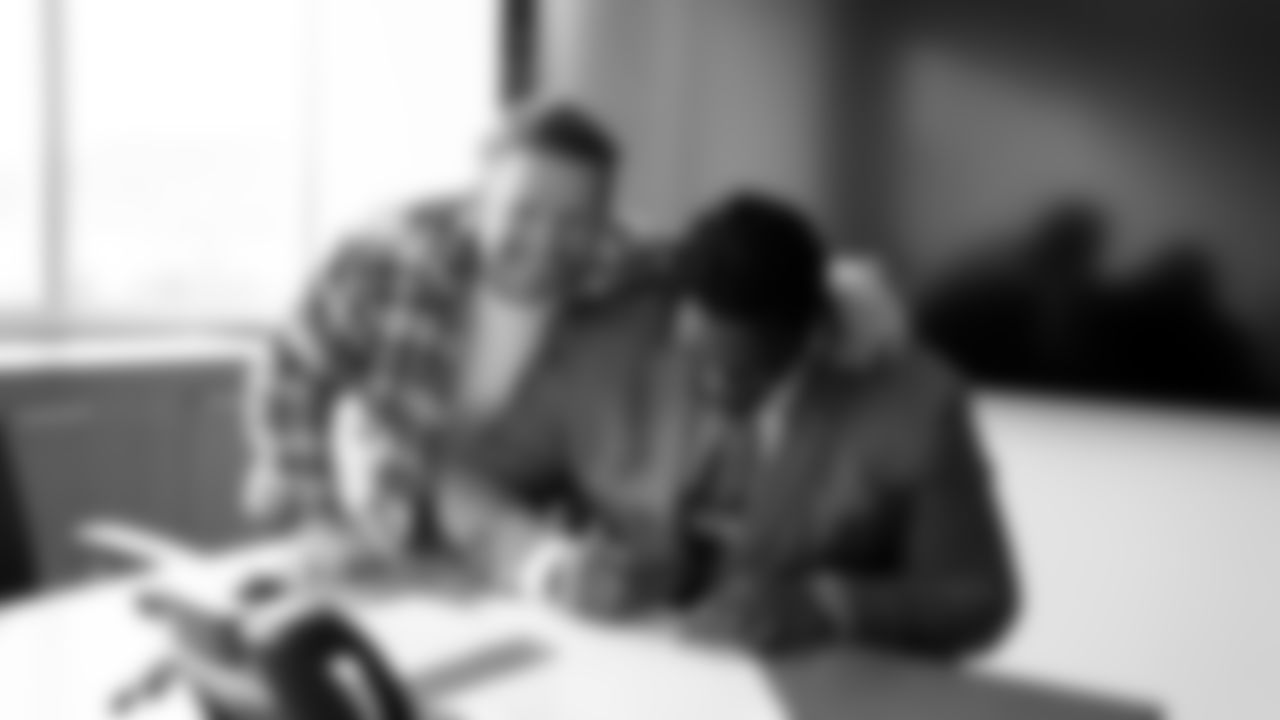 Seahawks guard Phil Haynes signs a contract extension with the team at the Virginia Mason Athletic Center in Renton, Wash. on February 21, 2023.