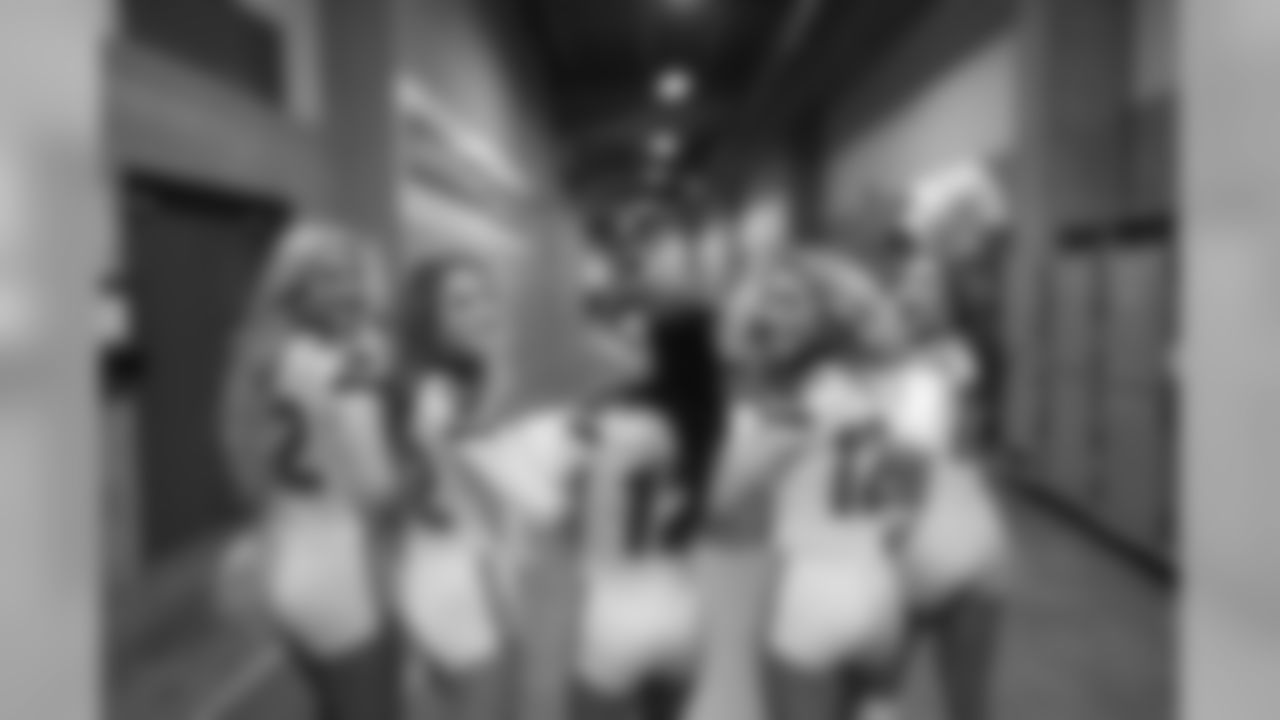 Jessica and pals walking down the East hallways for their pregame performance -- almost show time!