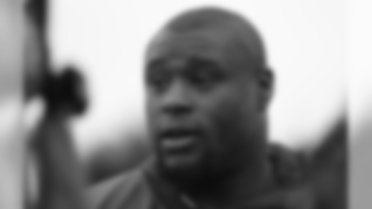 Earl Watford of the Arizona Cardinals is interviewed before an NFL training session at the London Irish rugby team training ground in the Sunbury-on-Thames suburb of south west London, Thursday, Oct. 19, 2017. The Arizona Cardinals are preparing for an NFL regular season game against the Los Angeles Rams in London on Sunday. (AP Photo/Kirsty Wigglesworth)