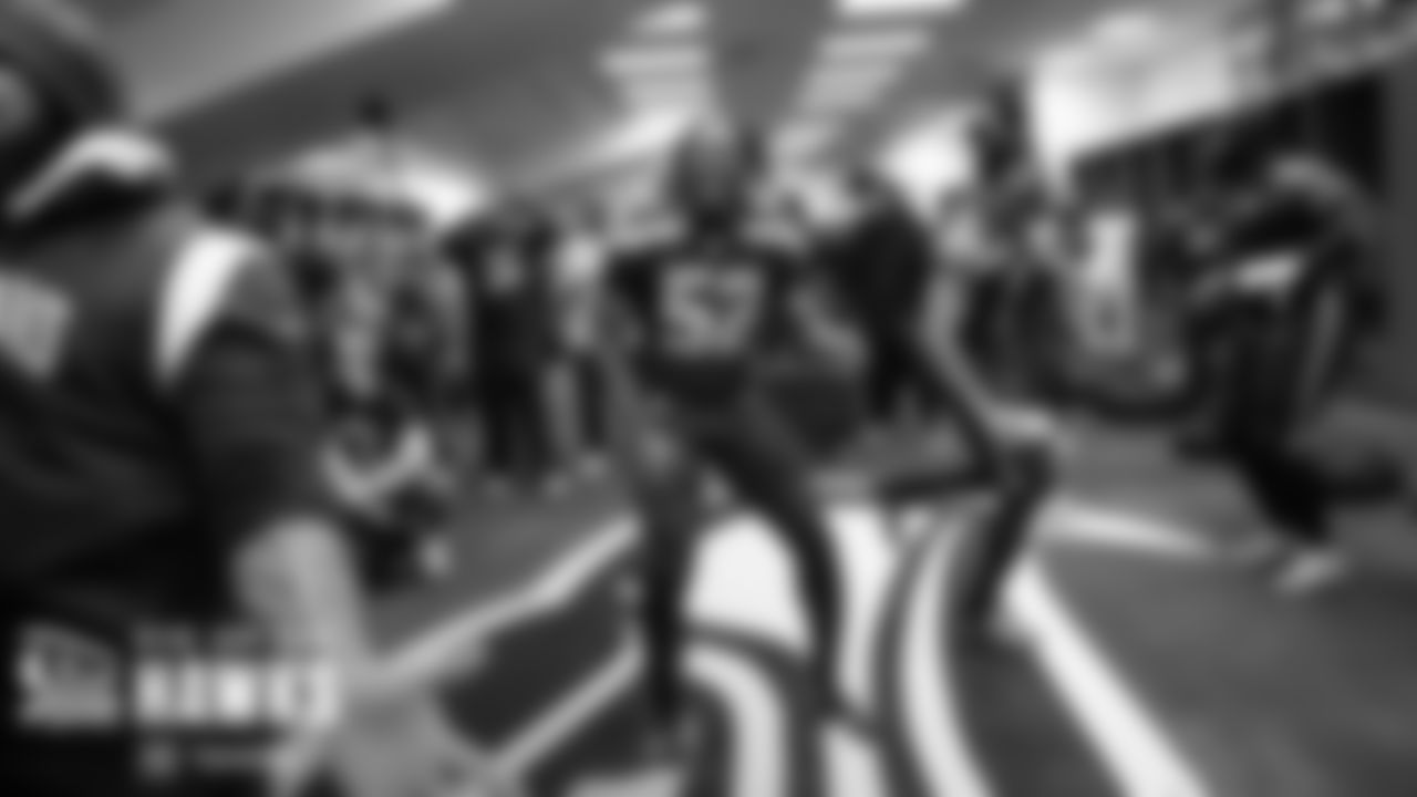 Seahawks linebcker Darrell Taylor and teammats dance in the locker room after the win.