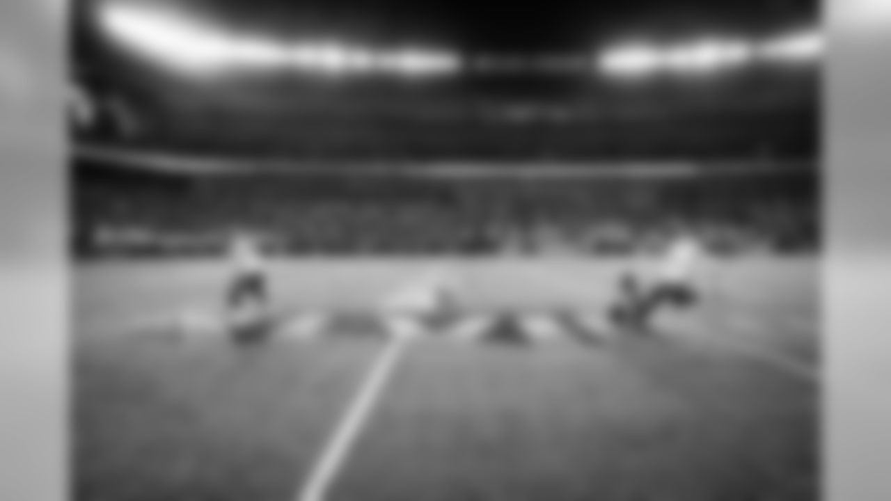 Long snapper Clint Gresham, holder Jon Ryan and kicker Steven Hauschka make one final practice field goal before heading to the locker room.