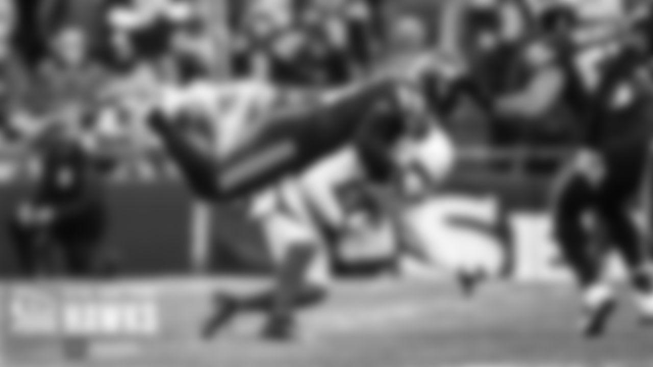 Seahawks safety Quandre Diggs dives on top of a Cardinals receiver.