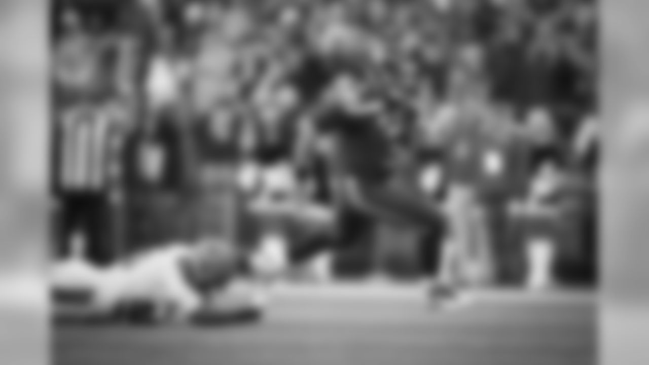 Quarterback Russell Wilson escapes the pocket for a 16-yard gain in the fourth quarter.