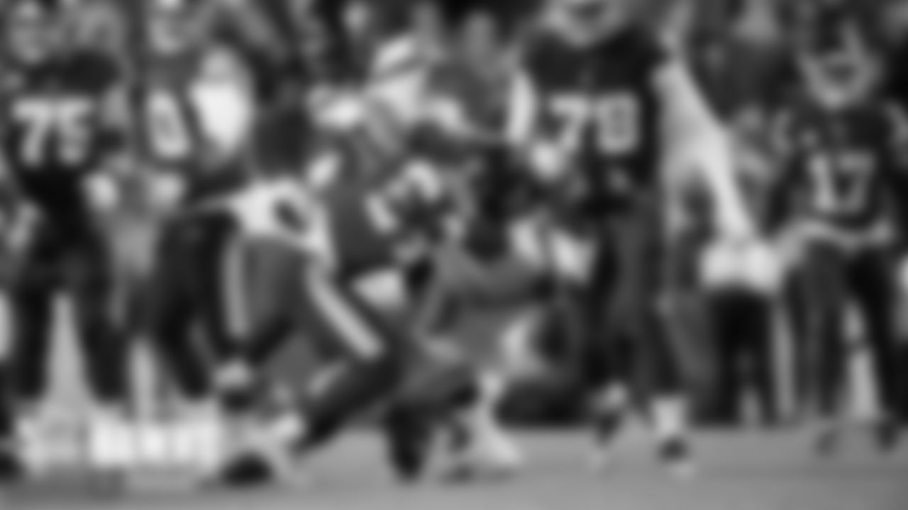 Seattle's Al Woods brings down Washington running back Antonio Gibson.
