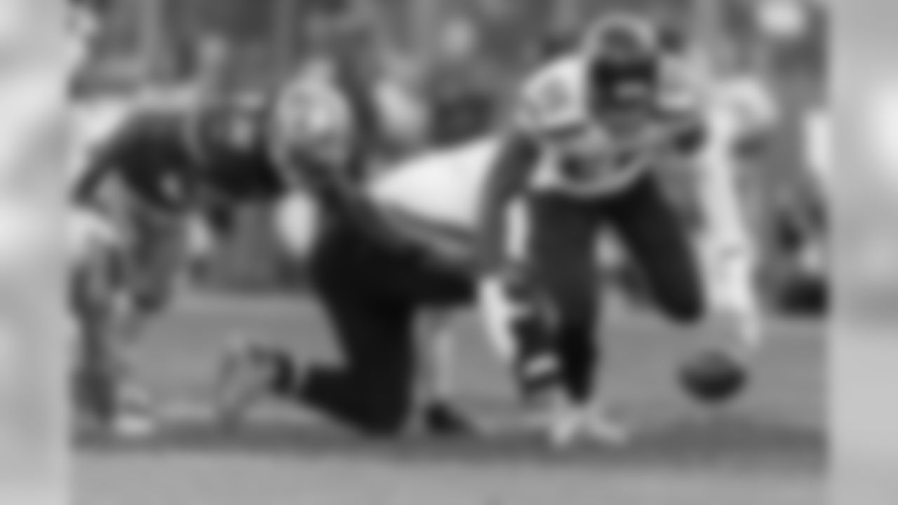 Defensive end Frank Clark corrals the loose ball.
