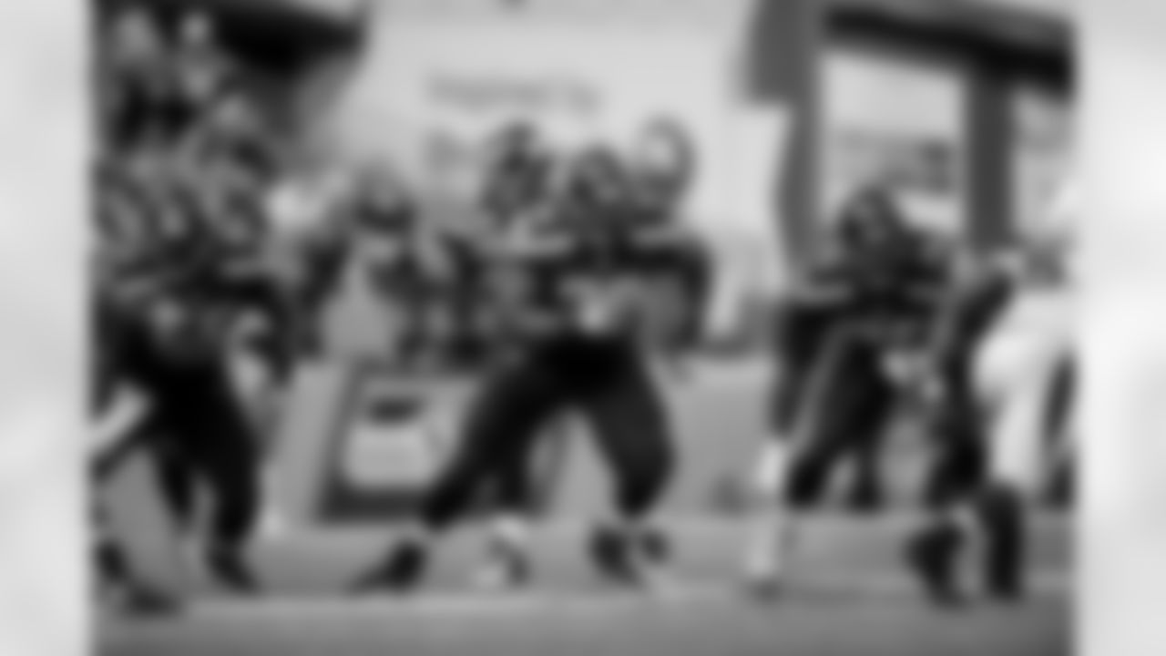 The left side of Seattle's offensive line fires out after the snap with center Patrick Lewis, guard Alvin Bailey and tackle Russell Okung looking to make their blocks.