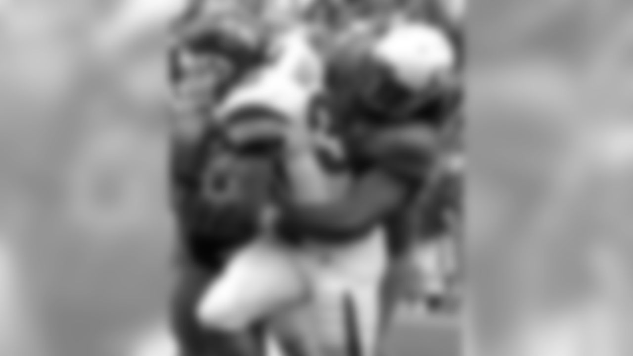 Oregon Will Tukuafu, right, and Blake Ferrras (90) tackle Utah's Eddie Wide (36) during the first half of an NCAA college football game in Eugene, Ore., Saturday Sept. 19, 2009. (AP Photo/Greg Wahl-Stephens)