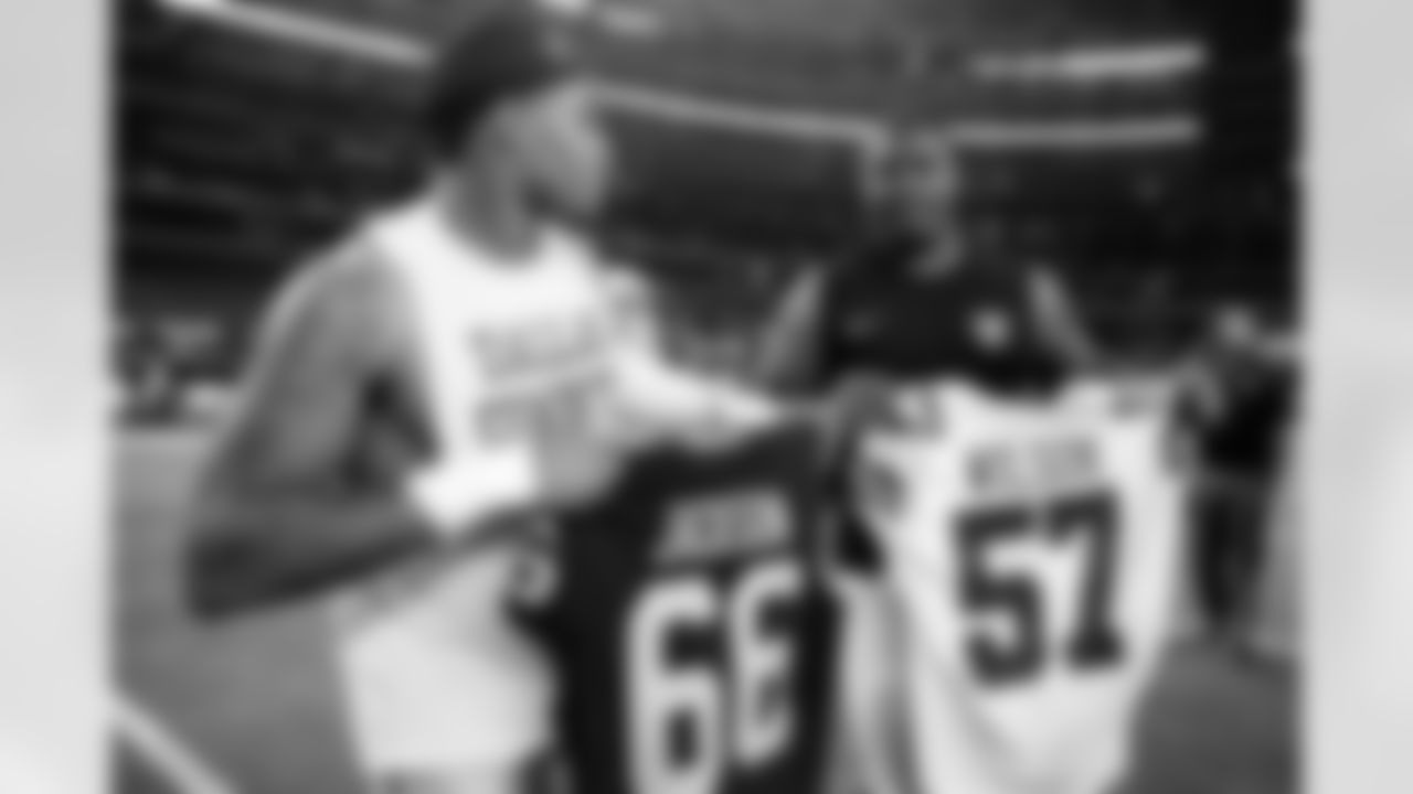 Dallas Cowboys linebacker Damien Wilson (57) and Oakland Raiders guard Gabe Jackson (66) exchange jerseys following an NFL football game on Saturday, Aug. 26, 2017, in Arlington, Texas. (NFL Photos via AP)