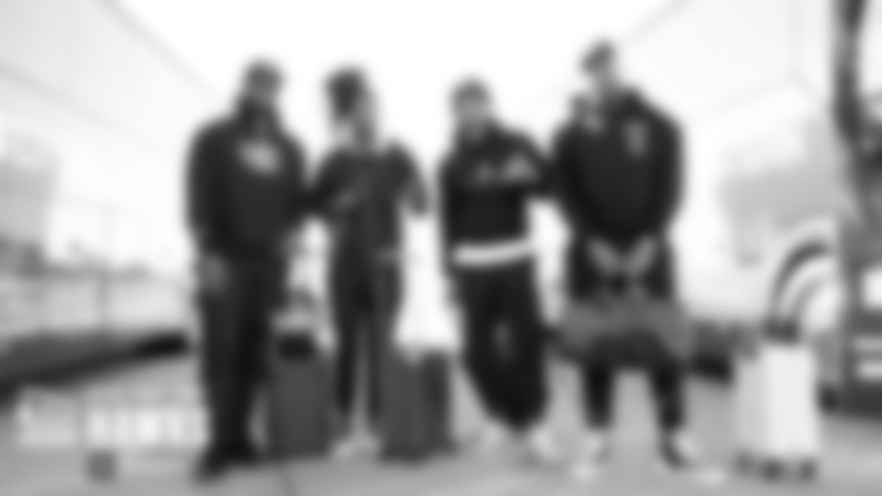 Seahawks defensive players Branden Jackson, Shaquill Griffin, Bradley McDougald and Quinton Jefferson pose before boarding the flight to Cleveland on Friday.