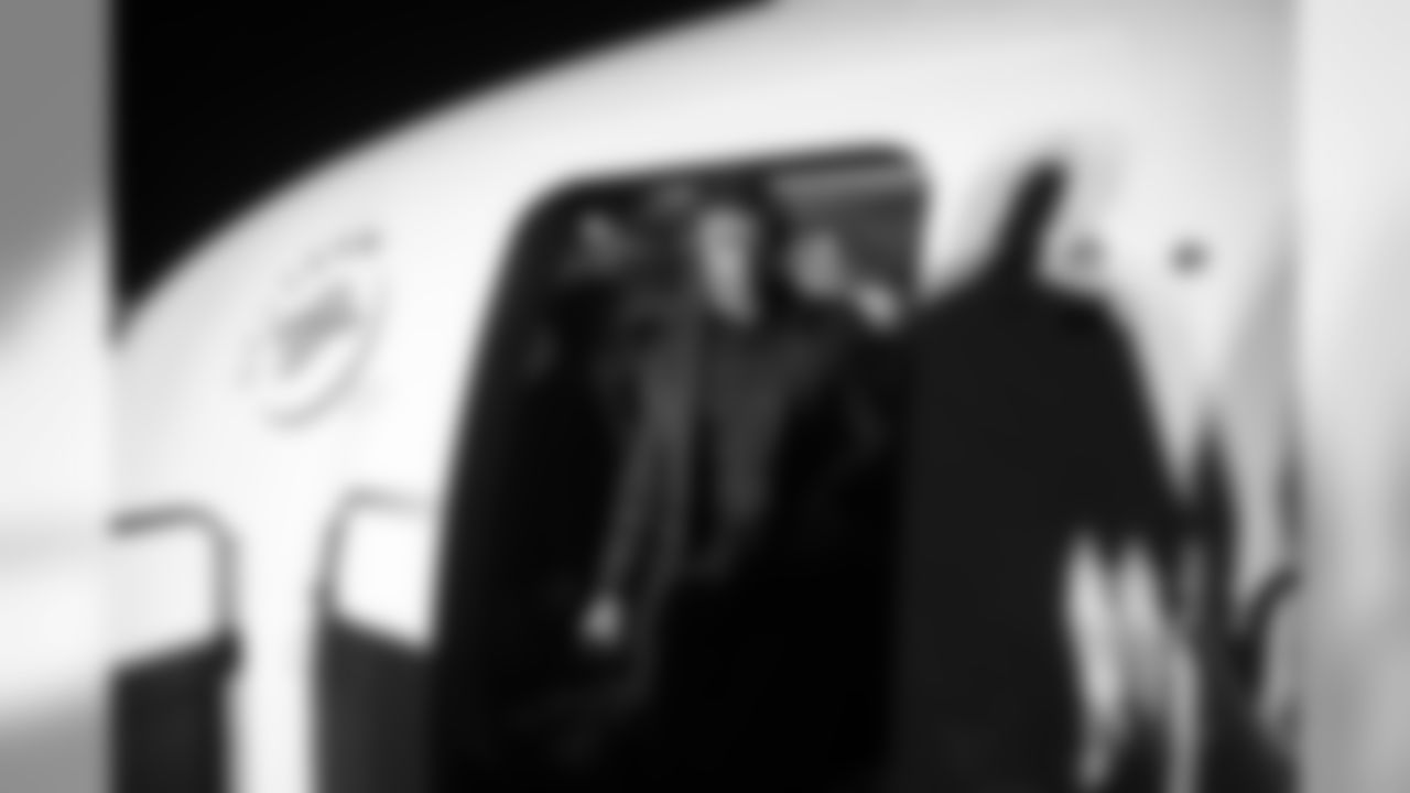 Quarterback Russell Wilson steps off the Delta charter flight upon arrival in Baltimore late Friday evening.