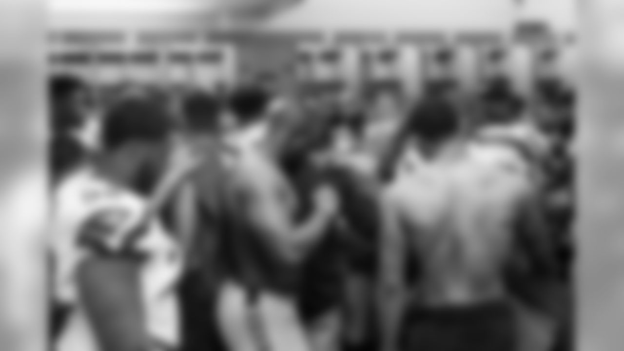 The Seahawks gather in the locker room after the game.