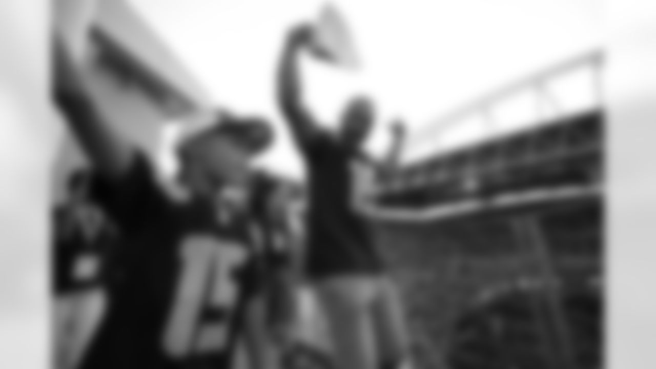 Seahawks legend Seneca Wallace raises the 12 Flag in advance of the preseason matchup vs. the Dallas Cowboys at Lumen Field on August 19, 2023.