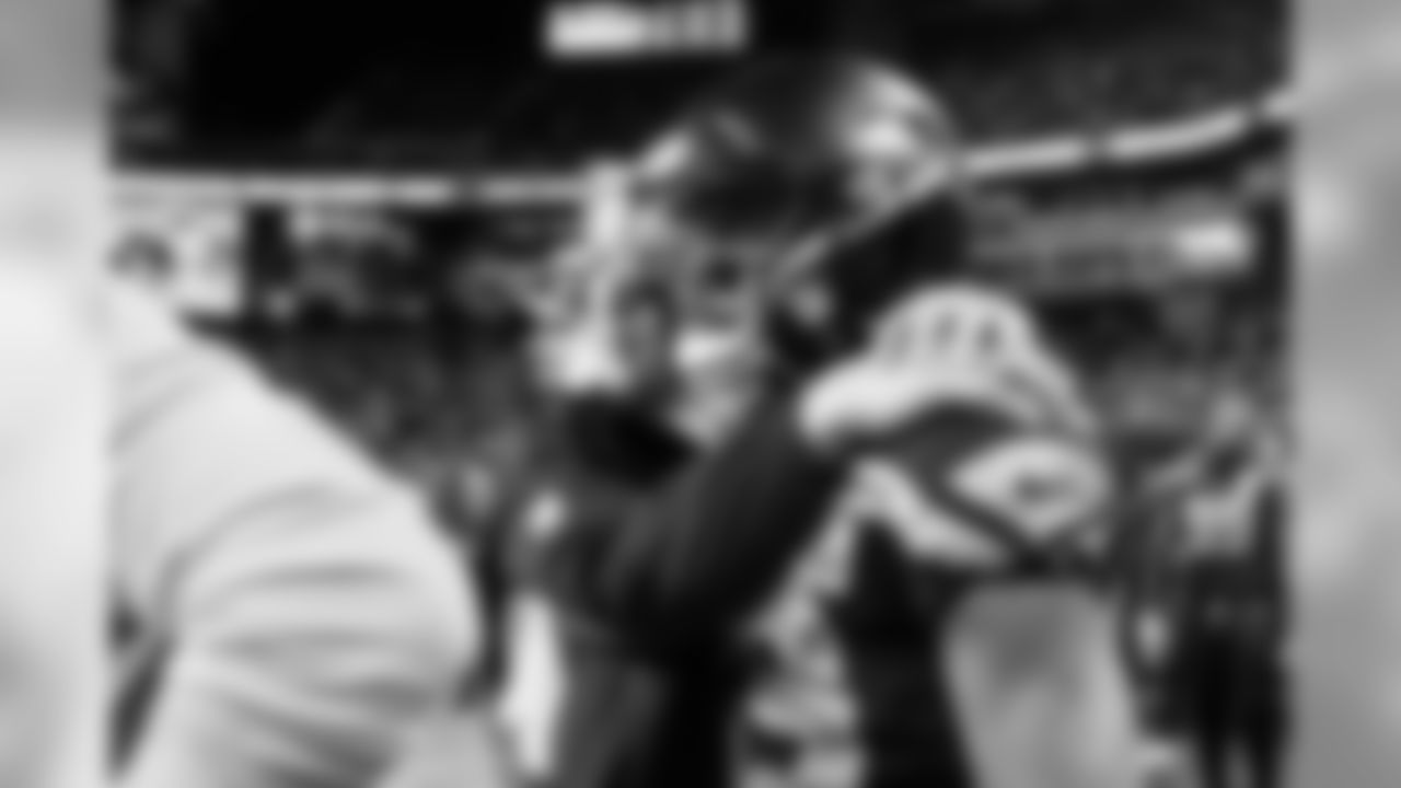 Head coach Pete Carroll puts his arms around receiver Doug Baldwin as the clock ticks down on the victory over the Chiefs, clinching a playoff berth for the Seahawks.