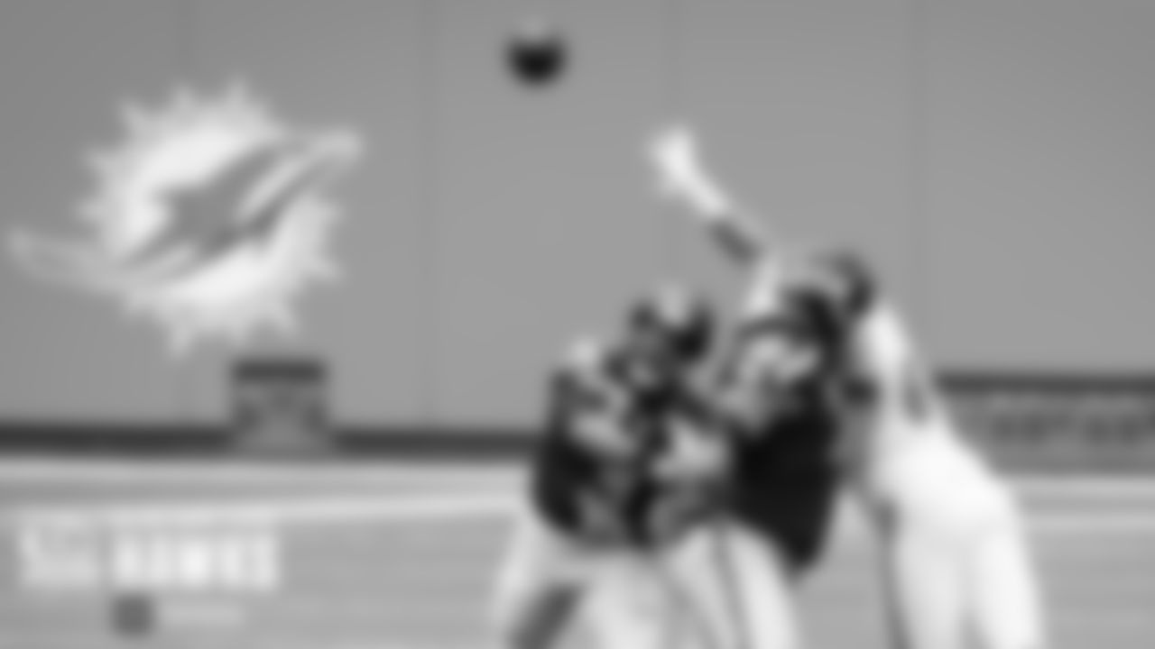 Seahawks quarterback Russell Wilson throws a pass under pressure in the first half.