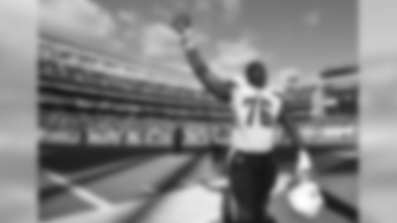 San Diego Chargers tackle D.J. Fluker celebrates after the Chargers defeated the Jacksonville Jaguars 33-14 in an NFL football game Sunday, Sept. 28, 2014 in San Diego. (AP Photo/Denis Poroy)