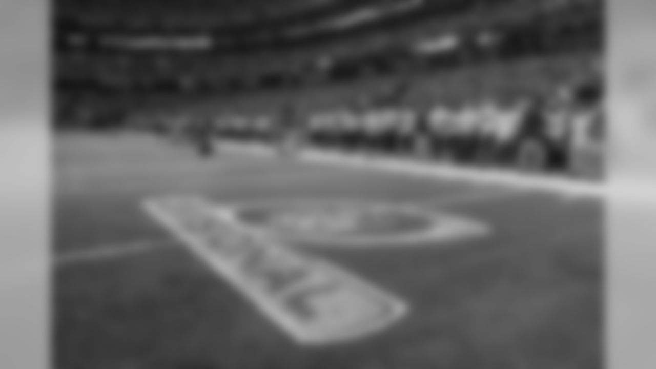 The Seahawks stand at attention for the national anthem prior to kickoff.