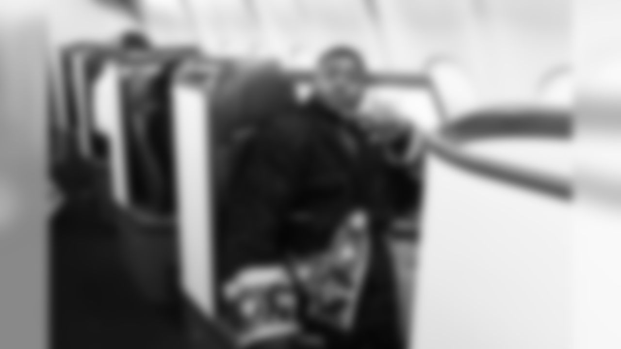 Defensive tackle Jarran Reed sports a robe befitting his first class seat for the victorious flight back to Seattle.