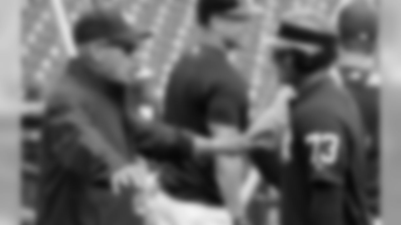 Seattle Seahawks quarterback Russell Wilson (73) talks with former New York Yankees player Reggie Jackson, left, during Yankees batting practice before a baseball spring exhibition game against the Atlanta Braves, Friday, March 2, 2018, in Tampa, Fla. (AP Photo/Lynne Sladky)