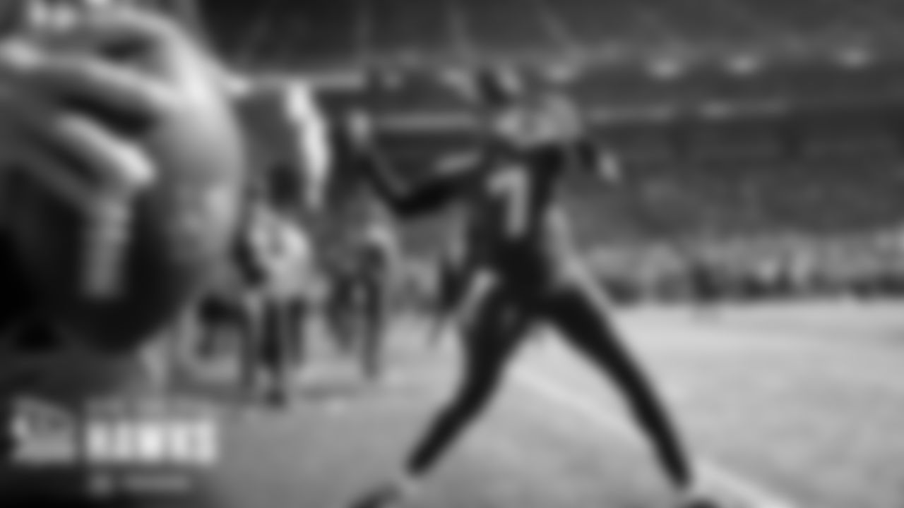 Quarterback Geno Smith fires a pass during warmups.