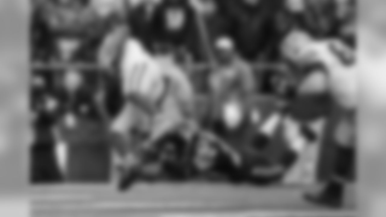 Earl Thomas makes a diving tackle of Green Bay's Randall Cobb in the second quarter.