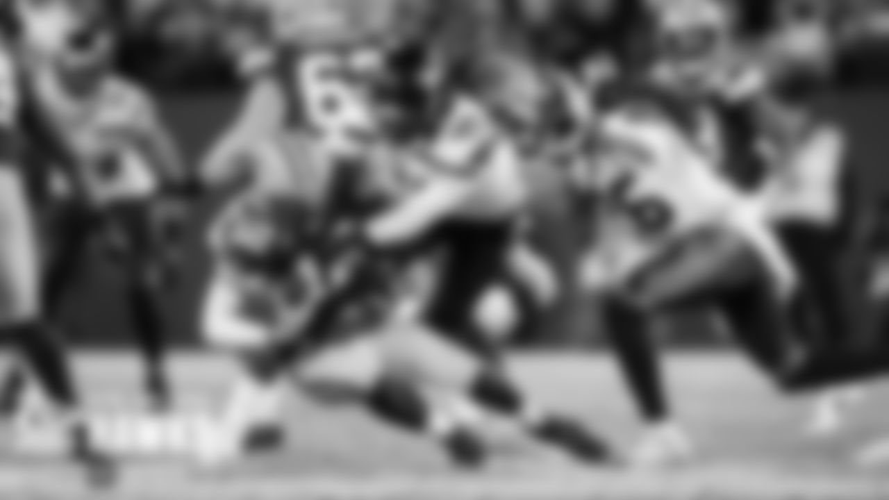Seahawks defenders Shaquem and Shaquill Griffin bring down Green Bay quarterback Aaron Rodgers in the fourth quarter.
