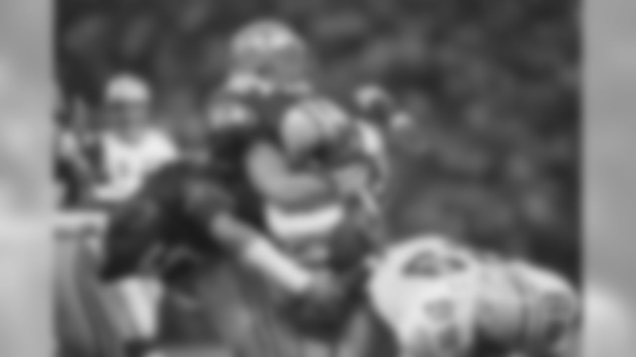 Brian Bosworth, top, of the Seattle Seahawks, tackles Kenneth Davis of the Green Bay Packers, holding him to a one-yard gain during the first quarter of their NFL game in Seattle, Nov. 15, 1987. Seattle beat Green Bay, 24-13. (AP Photo/Barry Sweet)