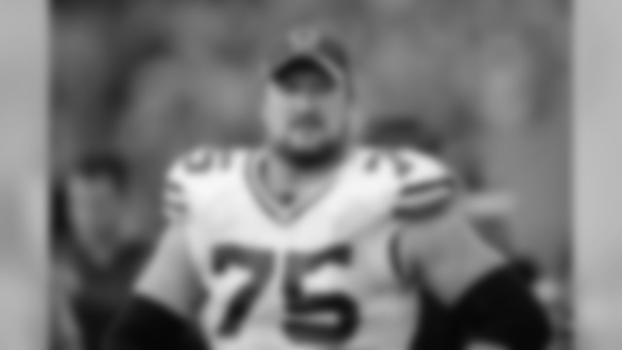 Green Bay Packers tackle Bryan Bulaga (75) watches from the sidelines in an NFL game against the Tennessee Titans, Sunday, Nov. 13, 2016 in Nashville, Tenn. (Margaret Bowles via AP)