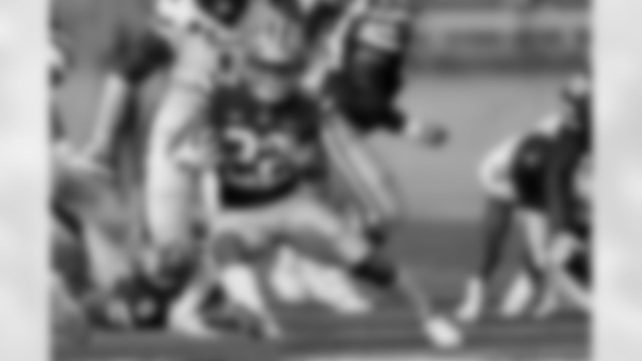 FILE - In this Oct. 3, 2020, file photo, Kansas State running back Deuce Vaughn runs for a first down during the first half of the team's NCAA college football game against Texas Tech in Manhattan, Kan. Vaughn is the only Big 12 player to lead his team in rushing and receiving, and is one of only two players nationally with at least 300 yards rushing and 300 yards receiving. (AP Photo/Charlie Riedel, File)