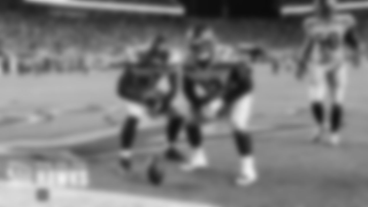 Seahawks Branden Jackson and Poona Ford celebrate after Ford recovered a fumble caused by teammate Jadeveon Clowney.