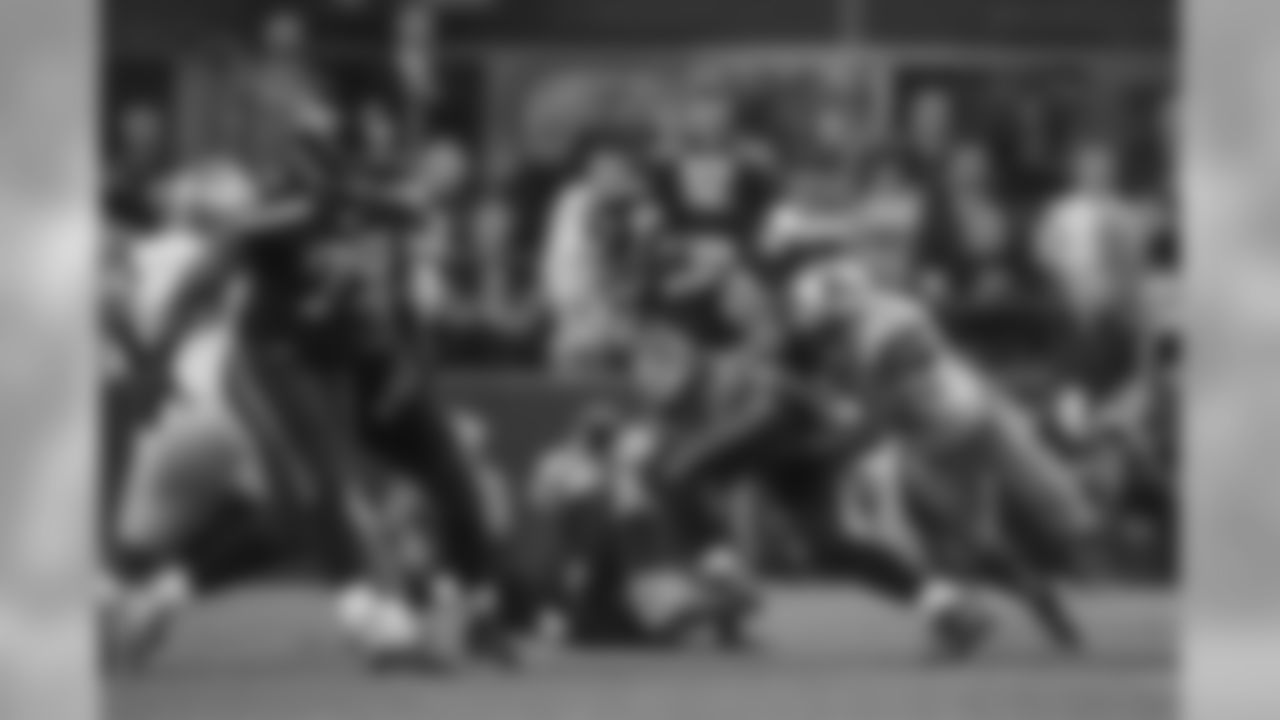 Quarterback Russell Wilson fumbles as he is hit in the fourth quarter.